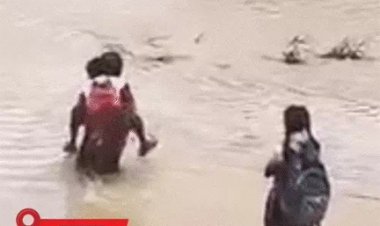 पुल बहा, जिंदगी ठहरी; पीठ पर बच्चों को पार कराया